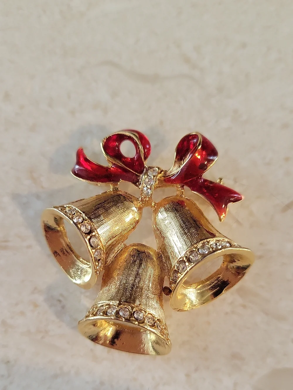 Gold-tone Holiday Bells Brooch with Red Enamel Bow